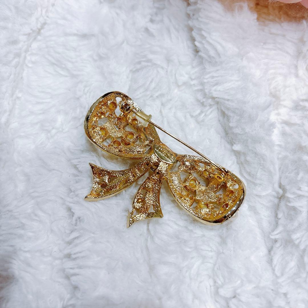 Rene リボン型ブローチ ゴールド系 パール