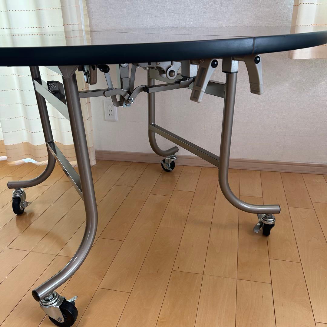 フライト式円型テーブル　折りたたみテーブル　直径120cm 丸テーブルキャスター
