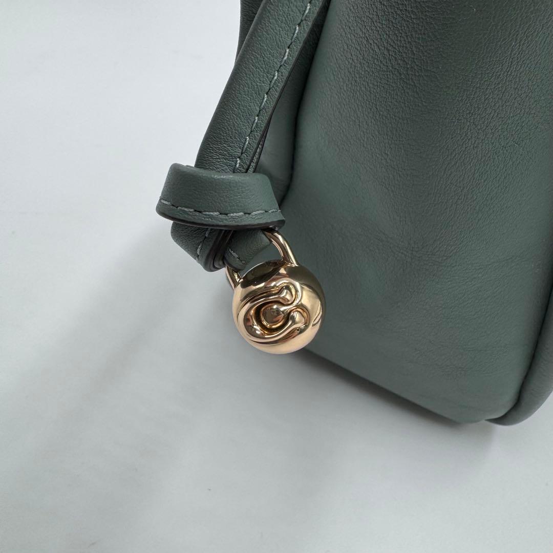 美品✨ コーチ フェイ ドローストリングバッグ レザー 巾着 ゴールド金具 水色