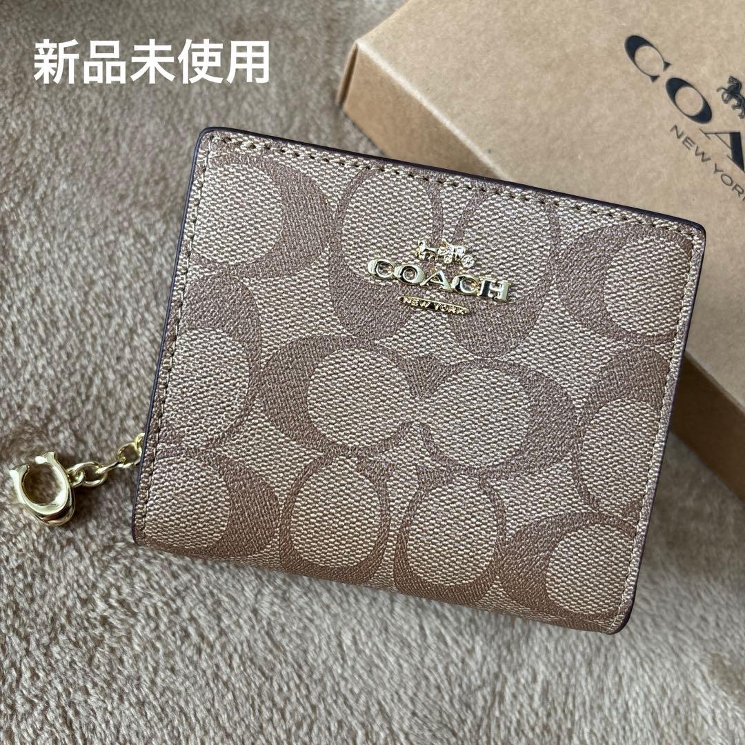 ゆかコーチ スナップウォレット シグネチャーキャンバス タン ブラウン