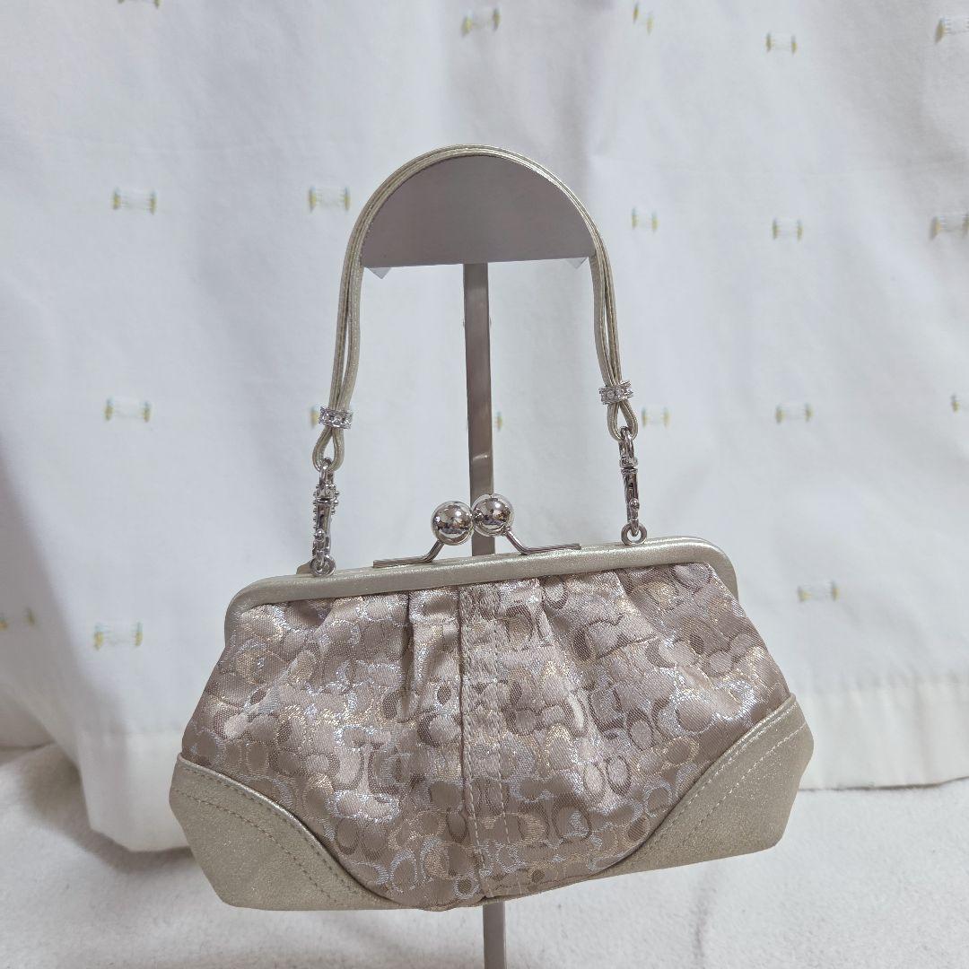 コーチ がま口バッグ シグネチャー ベージュ ゴールド　パーティーバック