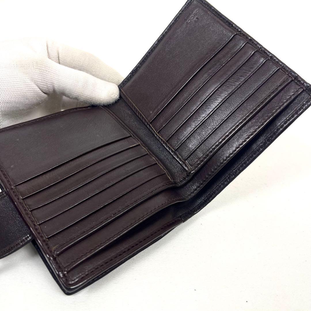 グッチ　二つ折り財布　アビー　シマレザー　ラウンドファスナー　ロゴ　エンボス