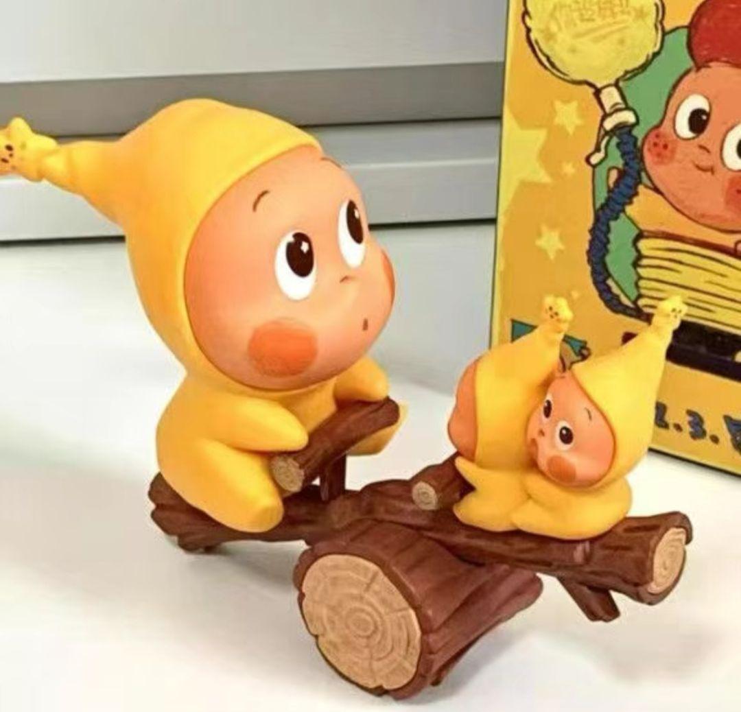 黄色い赤ちゃんキャラクター フィギュア