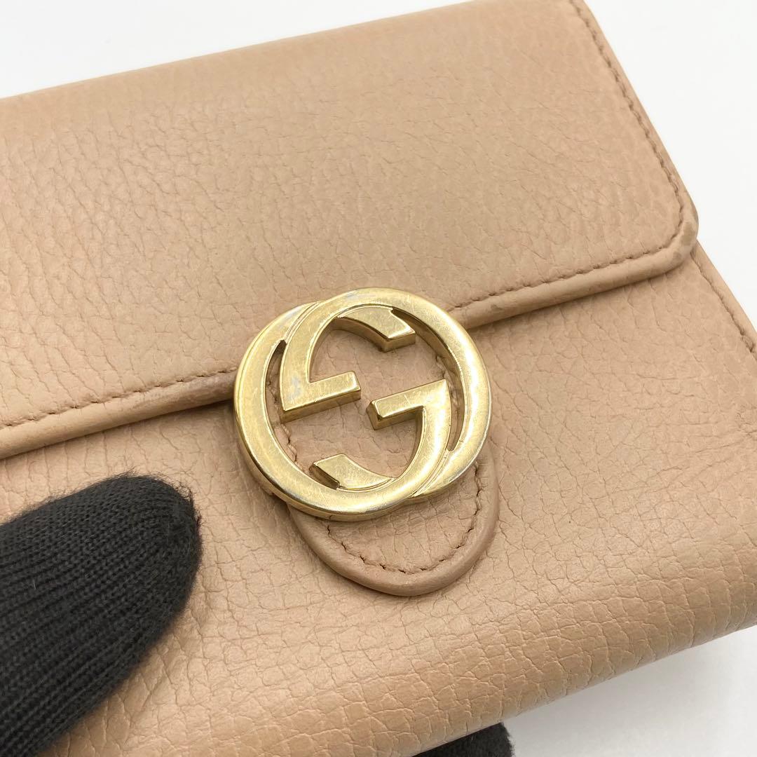 GUCCI インターロッキングG ダラーカーフ 二つ折り財布 ゴールド　ベージュ