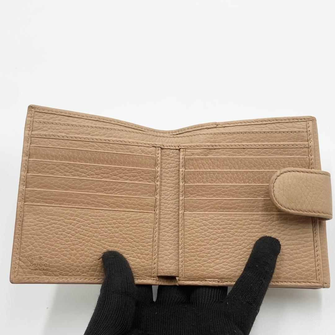 GUCCI インターロッキングG ダラーカーフ 二つ折り財布 ゴールド　ベージュ
