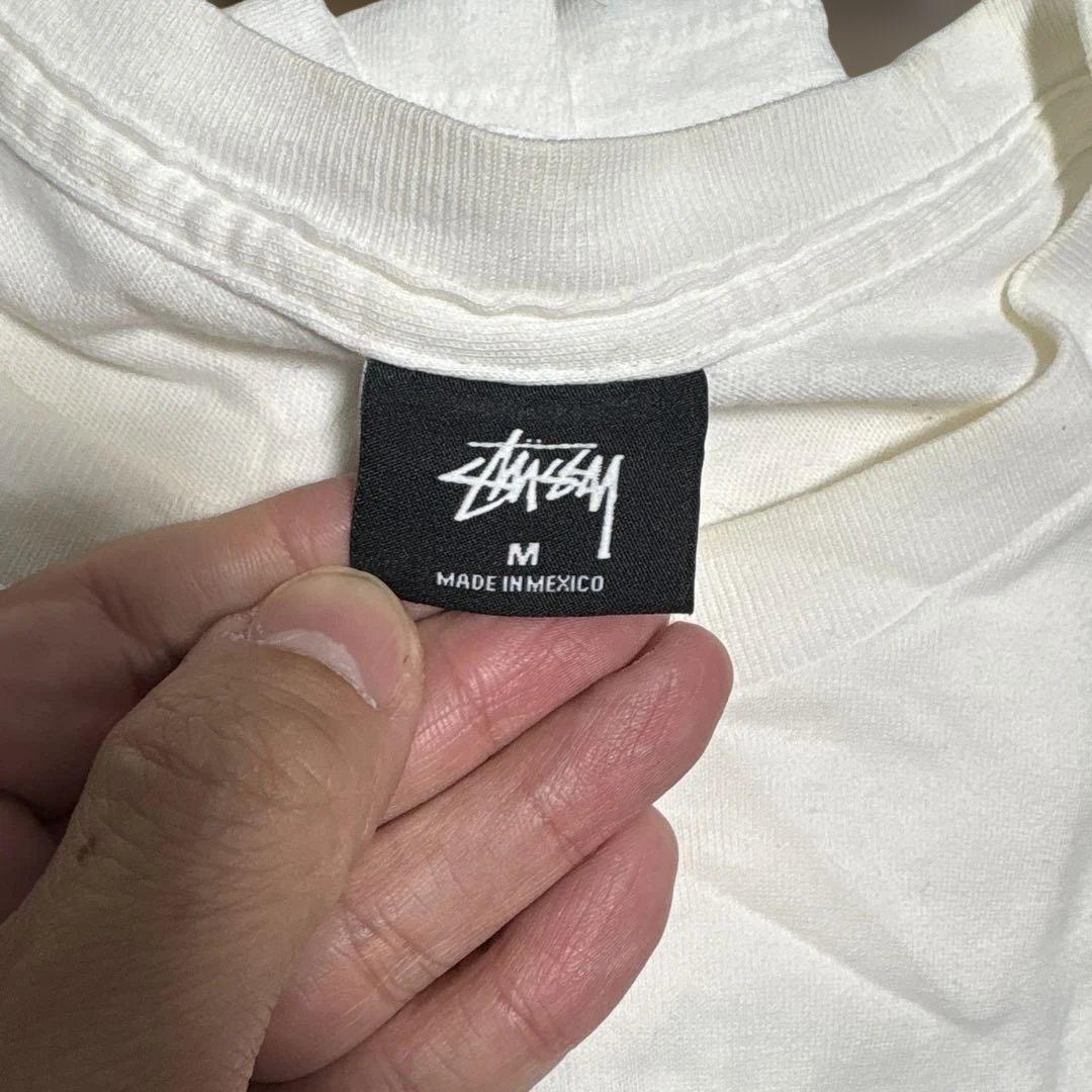 トップス STUSSY PRINTEMPS Tee CHANEL KARLLAGERFEL