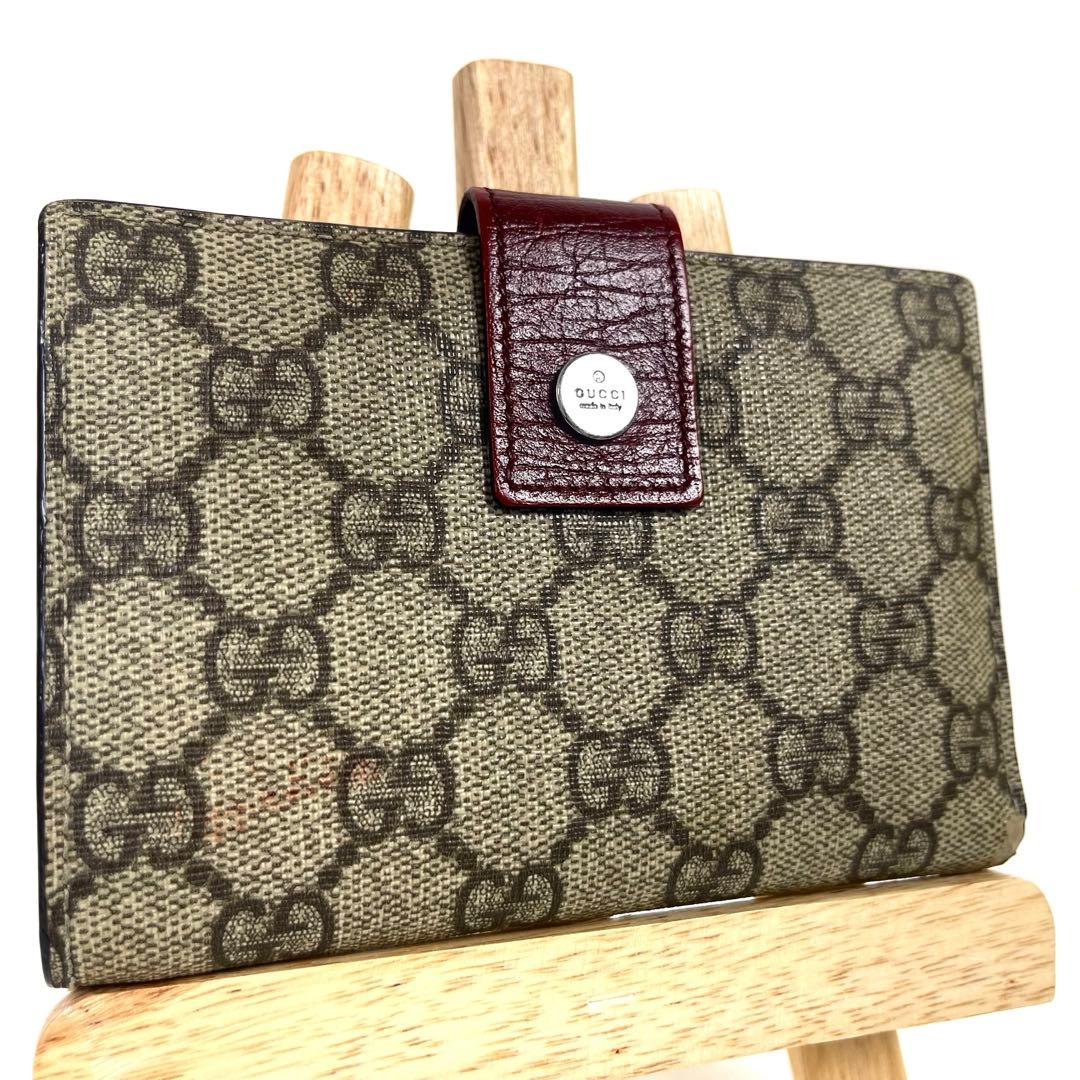 グッチ　折り財布　GGスプリーム　ロゴ総柄　がま口　ミディアム　PVC レザー