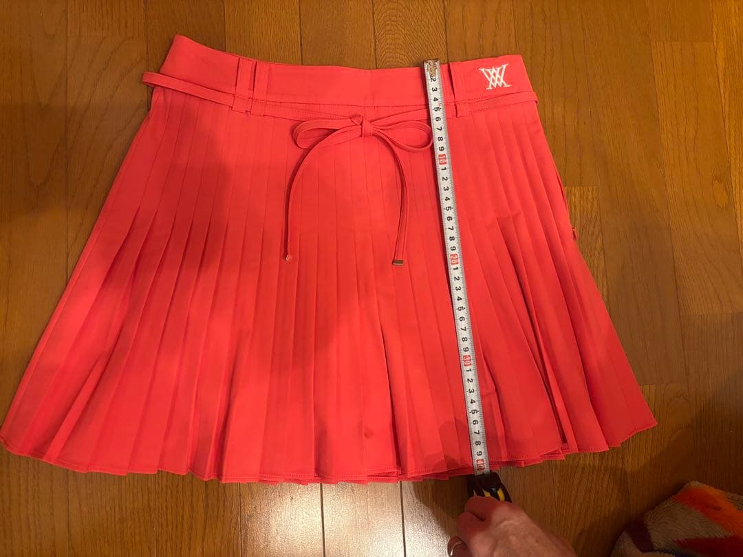 アニユーゴルフ　コーラルピンク プリーツスカート