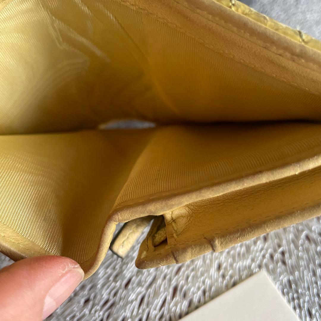 グッチ折財布　パイソンマーモントイエロー。箱付き