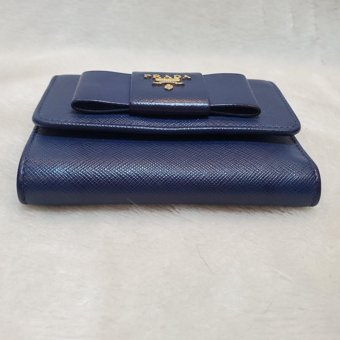 美品　PRADA 折り財布 サフィアーノ メタルロゴ リボン ブルー