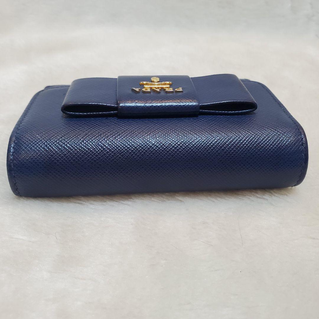 美品　PRADA 折り財布 サフィアーノ メタルロゴ リボン ブルー