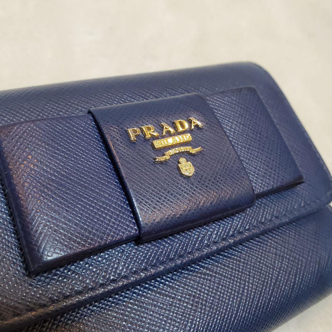 美品　PRADA 折り財布 サフィアーノ メタルロゴ リボン ブルー
