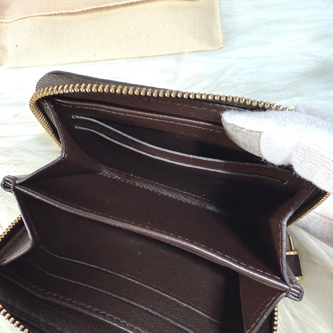 美品 ルイヴィトン パイソン モノグラム ジッピーパース ラウンド 茶色