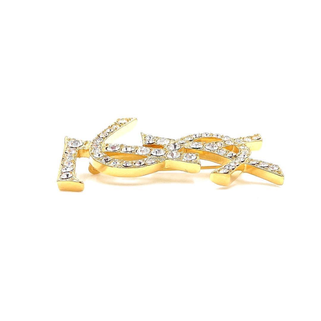 イヴサンローラン YSL ロゴ ラインストーン ブローチ レディース ゴールド