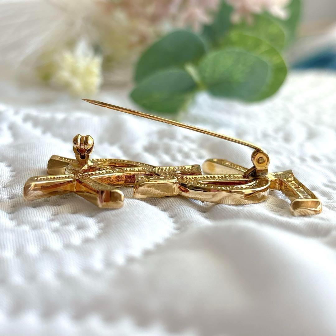 極美品 イヴサンローラン ブローチ カサンドラ ロゴ YSL ゴールド 人気