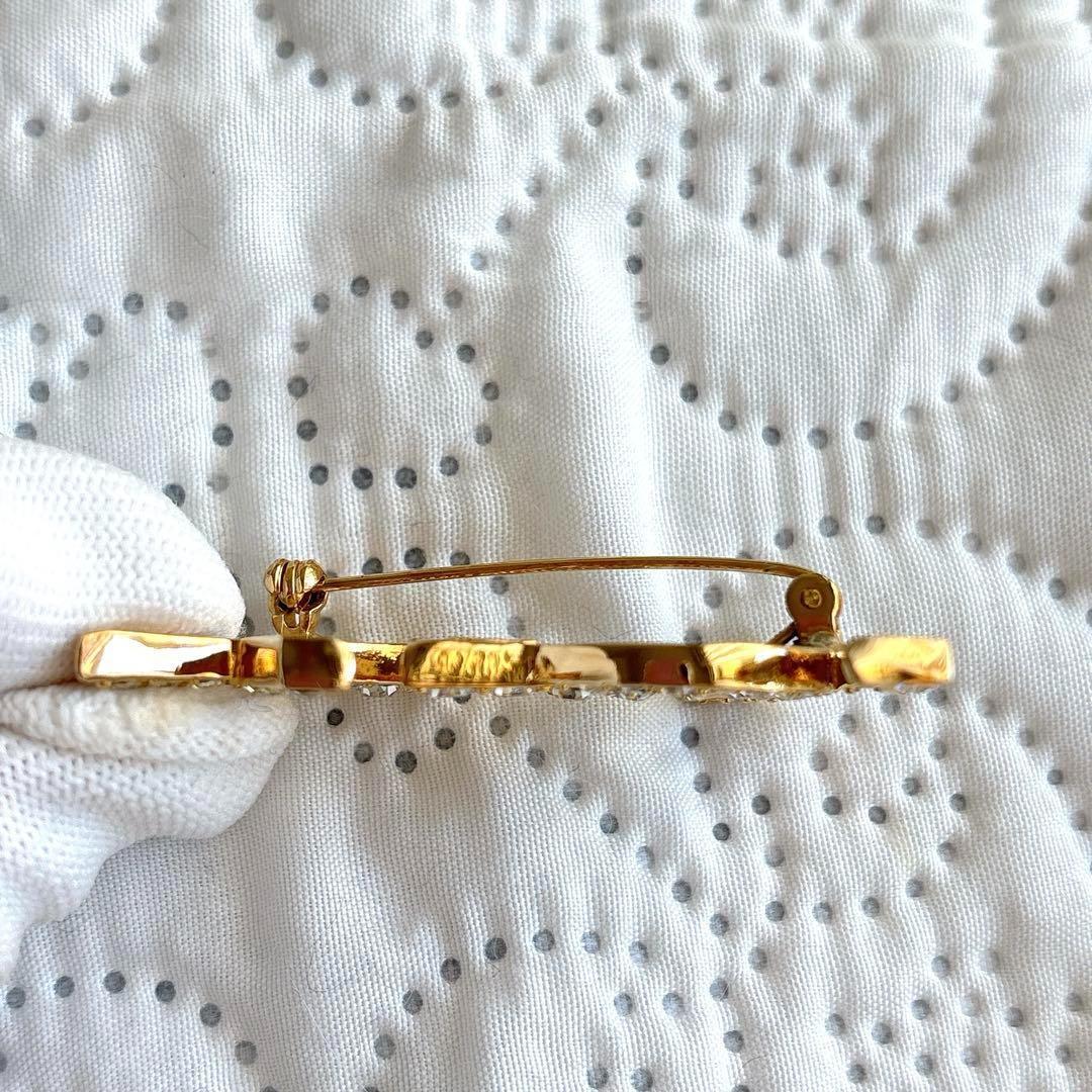 極美品 イヴサンローラン ブローチ カサンドラ ロゴ YSL ゴールド 人気