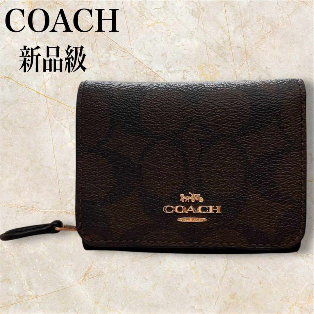 ヌルホリラ様 新品級✨ COACH コーチ シグネチャー柄 三つ折り財布
