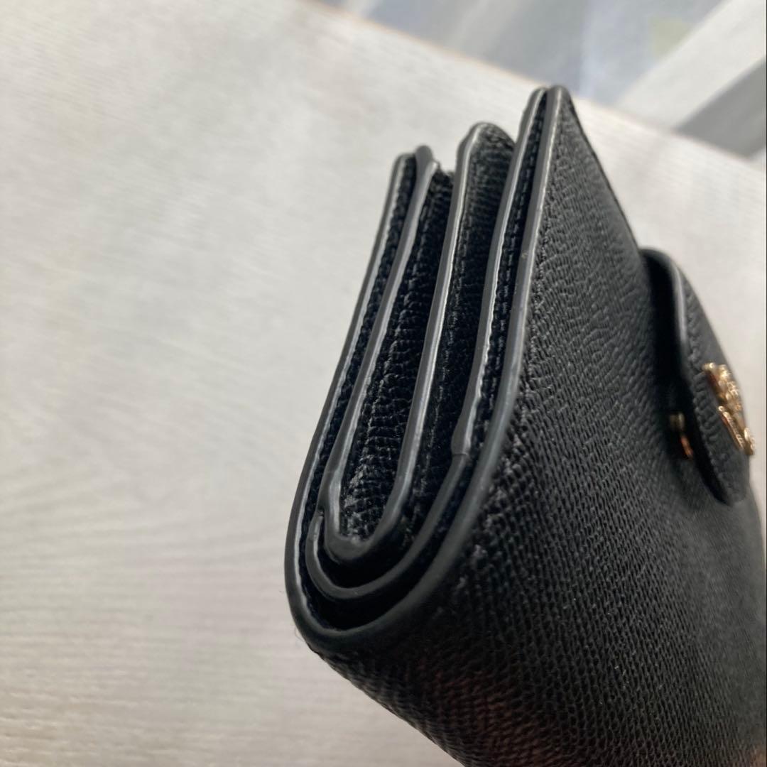 COACH コーチ　2つ折財布黒　ゴールド金具馬車ロゴ