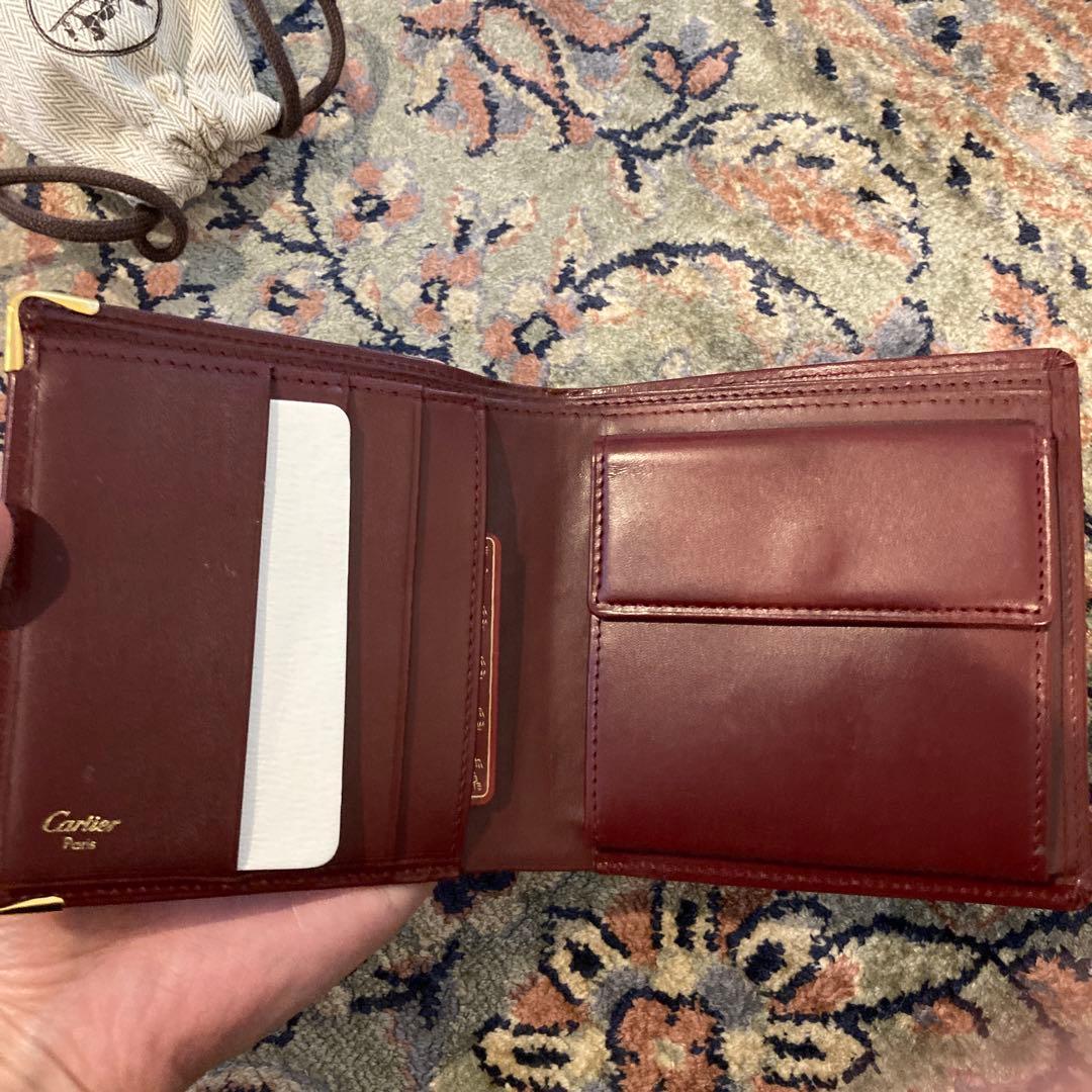 Cartier カルティエ　エンボスロゴ　二つ折り財布 ボルドー