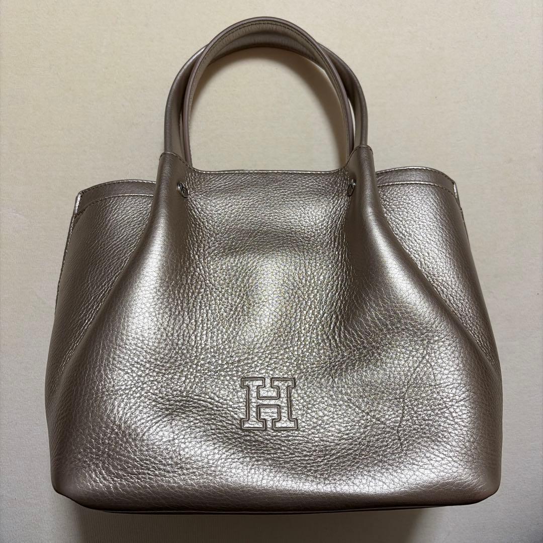 ヒロフ　メタリックゴールド レザー ハンドバッグ