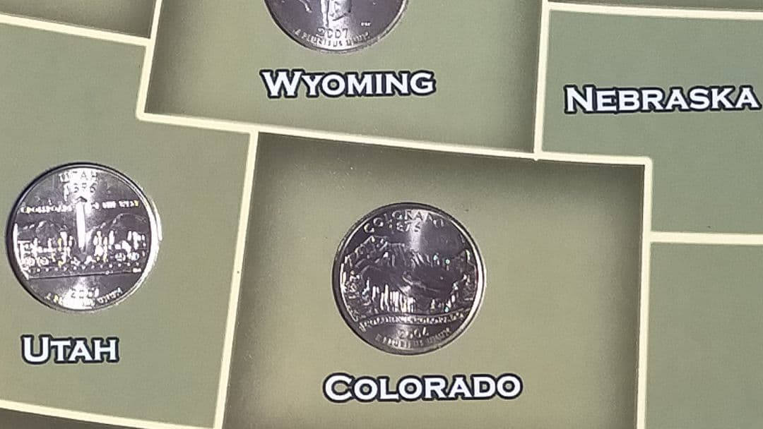 ☆。アメリカ25セントクォーター50州記念アルバム(56枚在中)。