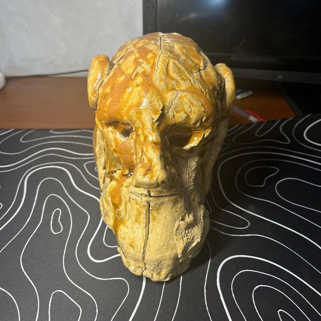 陶土製 人間と犬の顔の彫刻