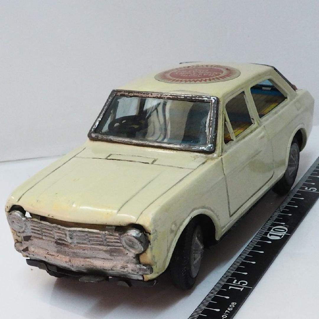 旭玩具【ダットサン サニー 1000 白 電動走行 動作不良】ブリキ製ミニカー