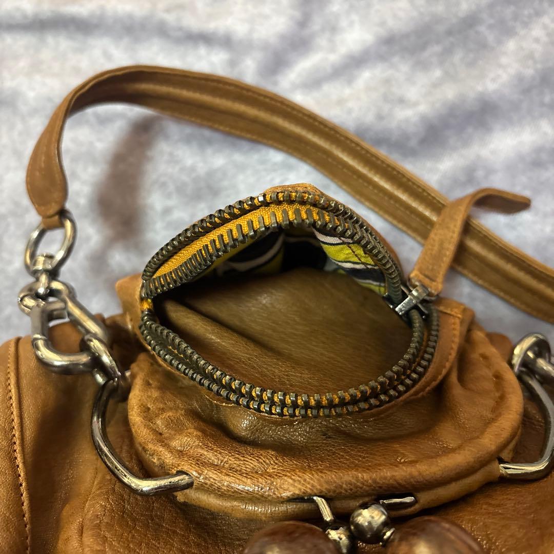 ジャマンピュエッシュ　レザー　ハンドバッグ　木製パーツ　がま口　総柄