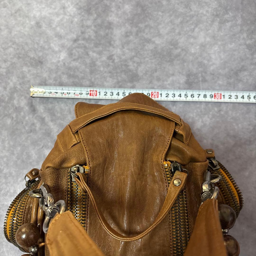 ジャマンピュエッシュ　レザー　ハンドバッグ　木製パーツ　がま口　総柄