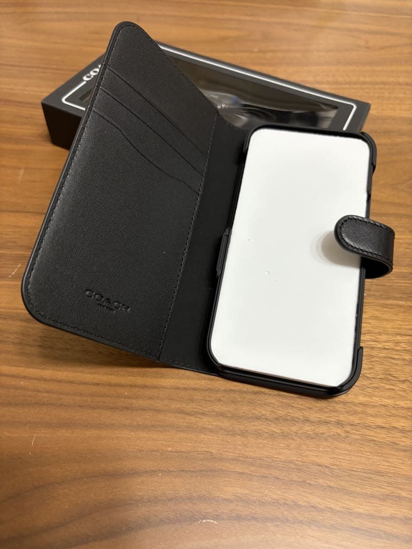 COACH iPhone14PROケース フォリオ・シグネチャー キャンバス