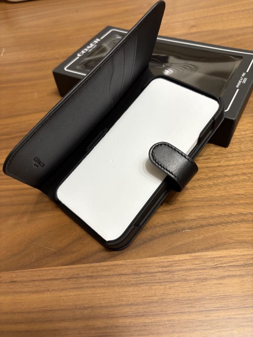 COACH iPhone14PROケース フォリオ・シグネチャー キャンバス