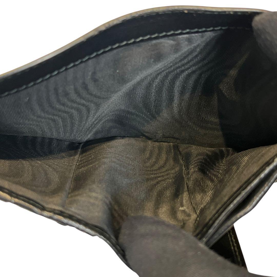 現行品✨ミュウミュウ 二つ折り財布 エンボス ロゴ 総柄 レザー 黒