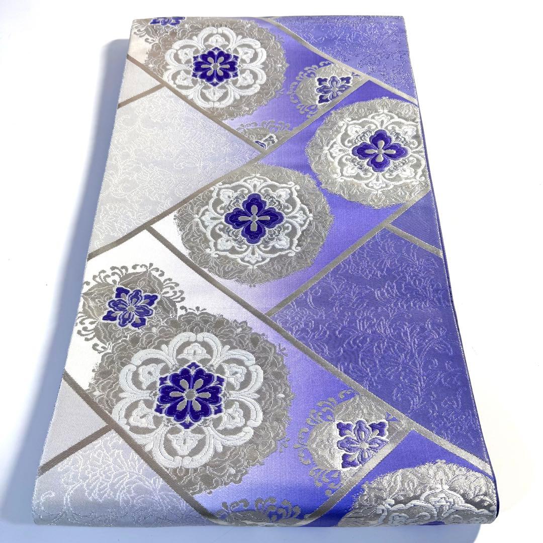 5k2491 袋帯　絹　唐織　正倉院文様　華文　紫　銀色　白　花柄　和装　着物