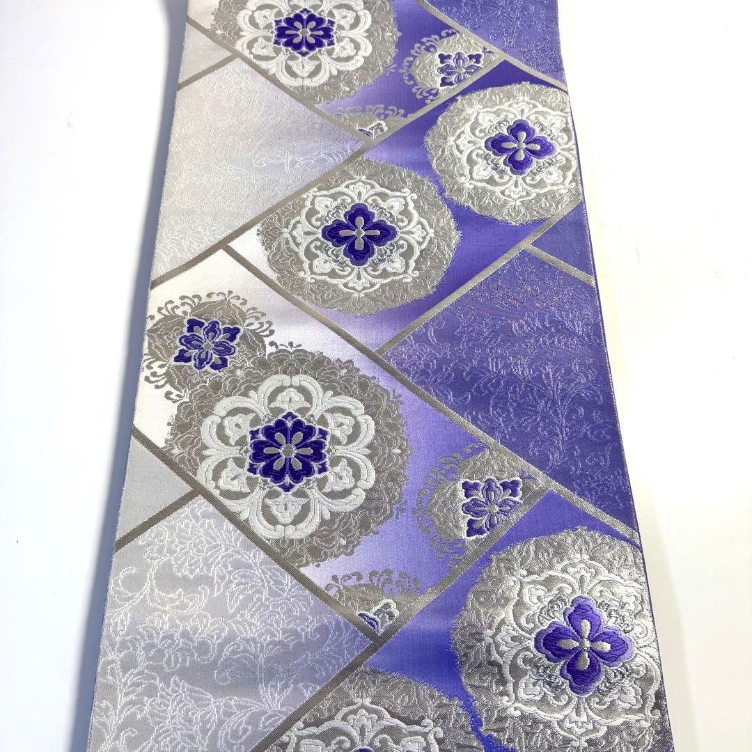 5k2491 袋帯　絹　唐織　正倉院文様　華文　紫　銀色　白　花柄　和装　着物