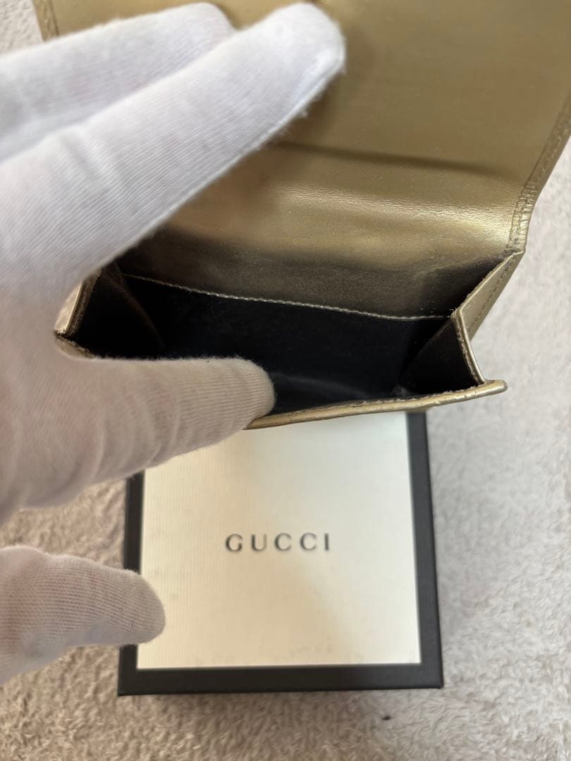 8*様 GUCCI ゴールド　二つ折り財布　グッチ　GGマーク