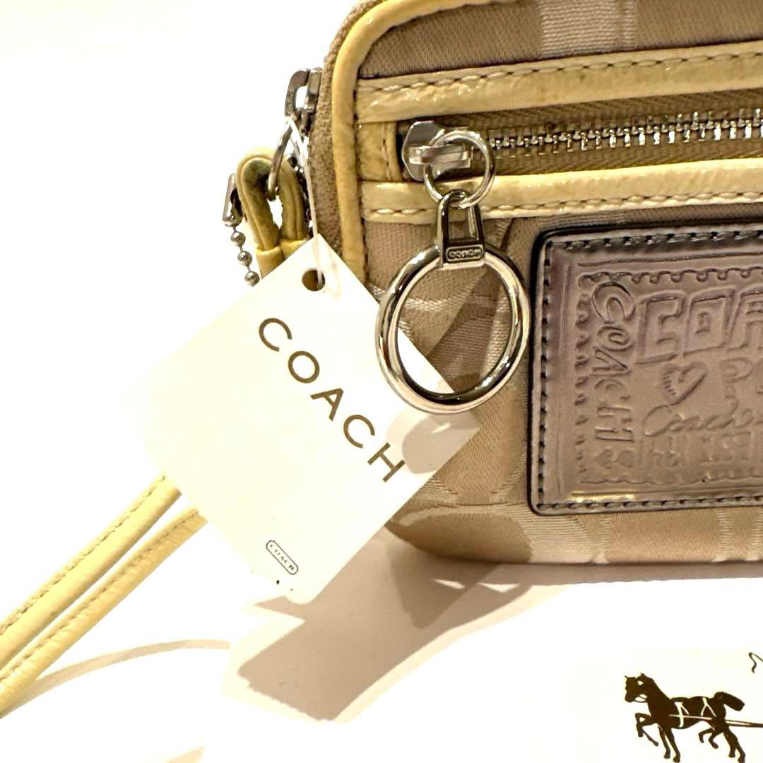 【新品】COACH コーチ シグネチャー柄キャンバス ポピー リストレットポーチ