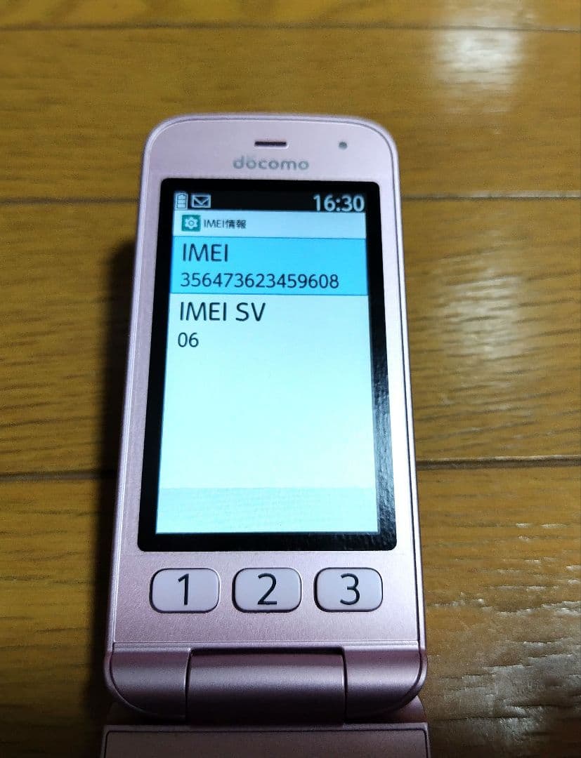 ドコモ　F-01M ガラケー　らくらくホン ピンク　純正卓上ホルダー付き