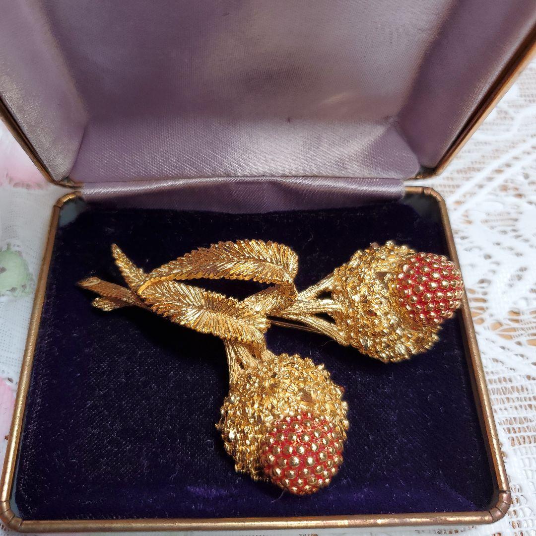 Carven 金色の花束ブローチ