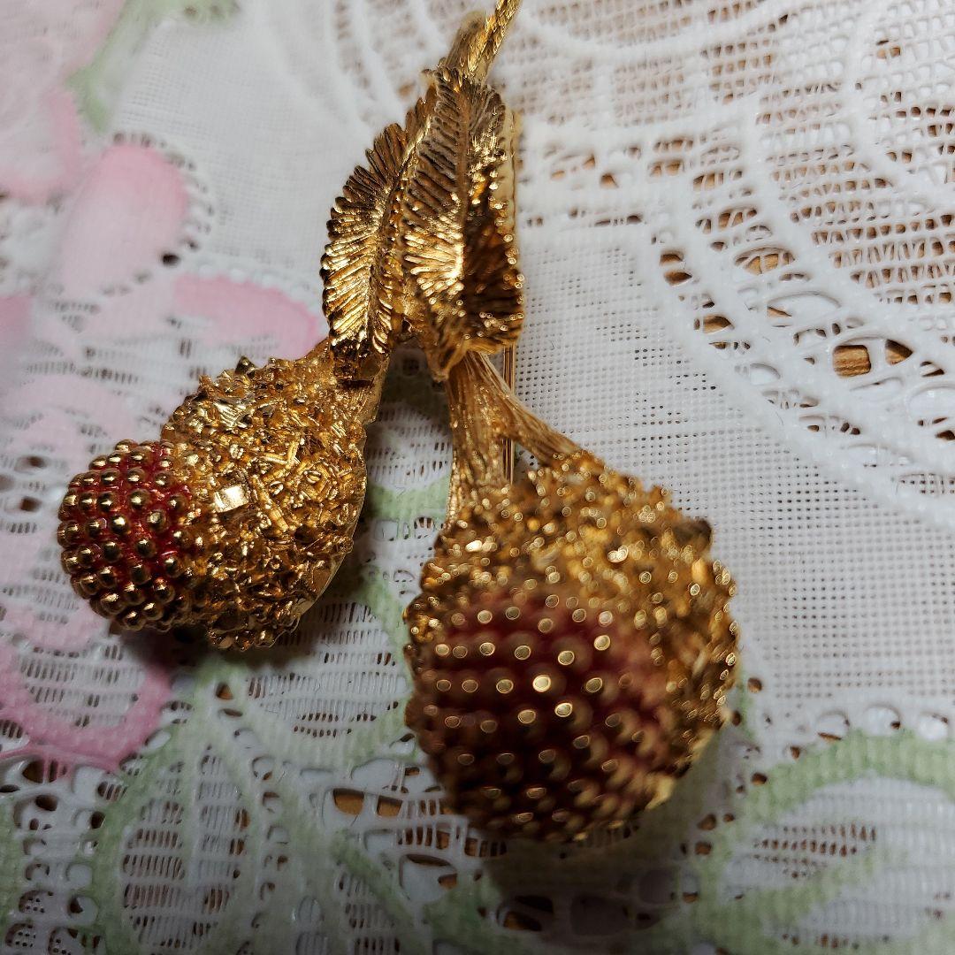 Carven 金色の花束ブローチ