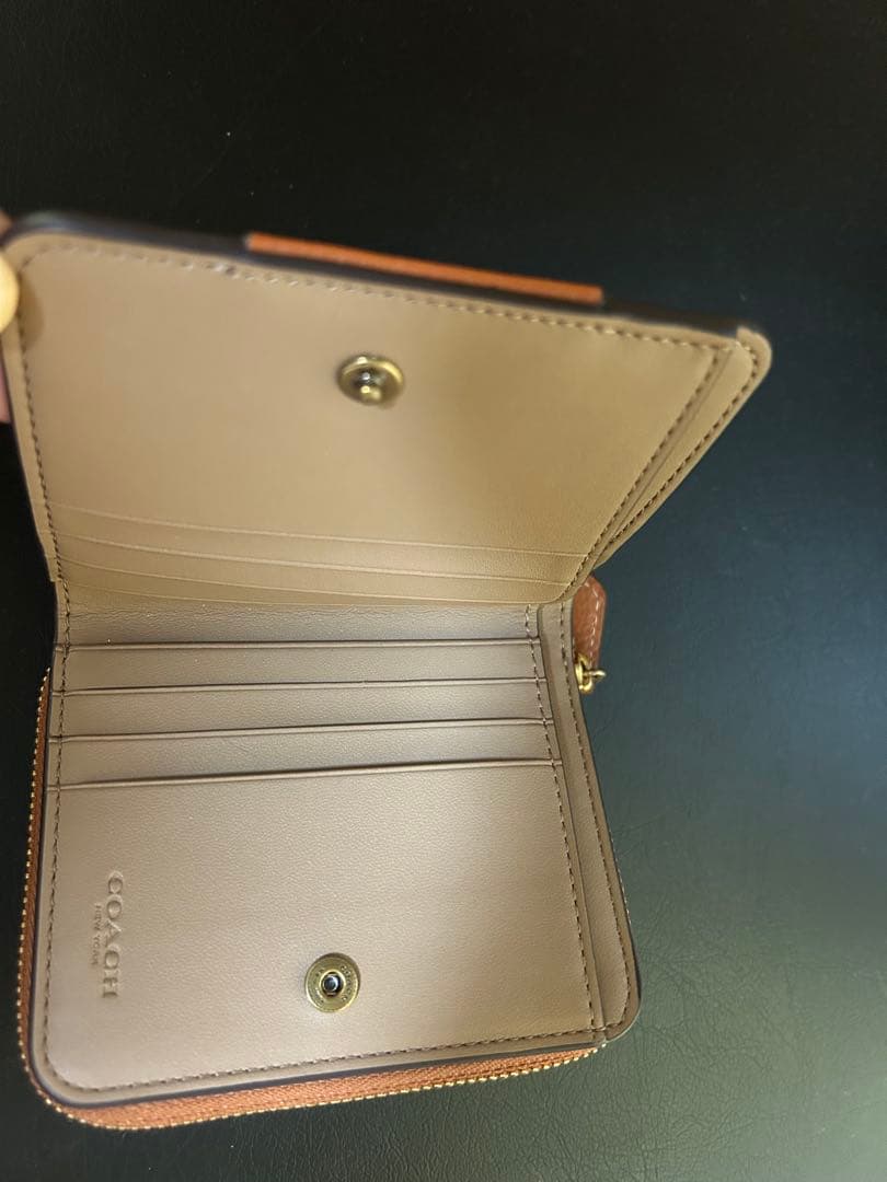 二つ折り財布 ブラウン/オレンジ　COACH 美品✨　馬車柄 コンパクト