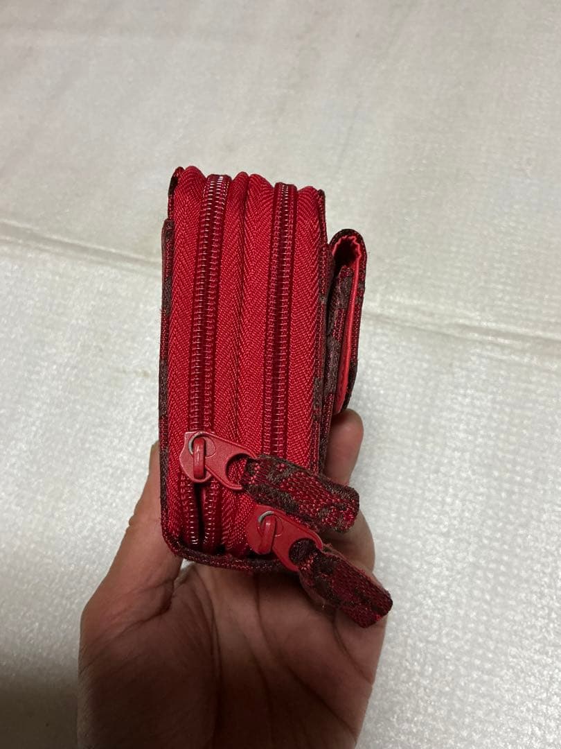 コーチ多用途財布／赤柄。【新品未使用品　長財布】。