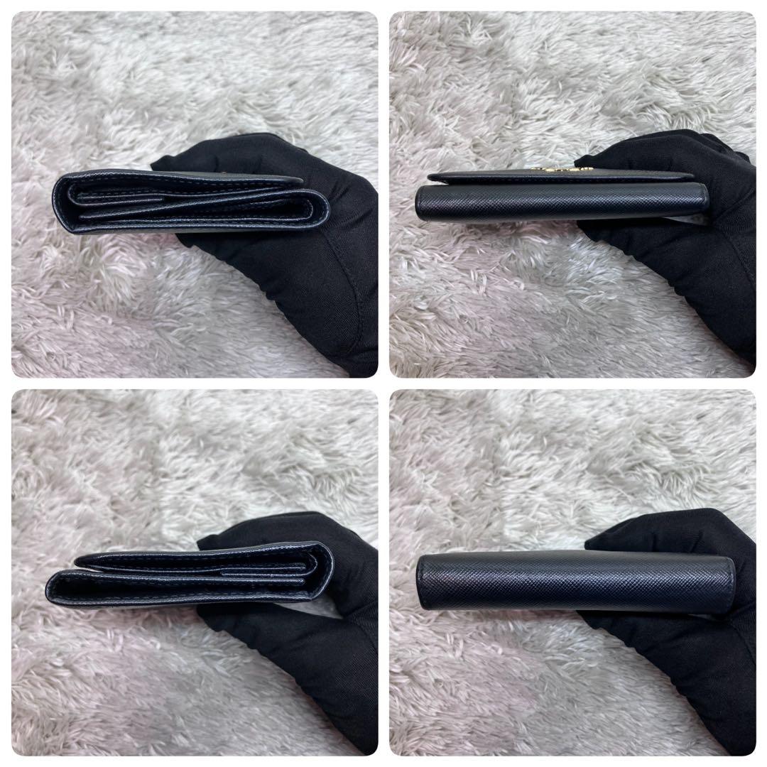 美品✨PRADA サフィアーノ メタルロゴ 二つ折り財布 フラップ ブラック