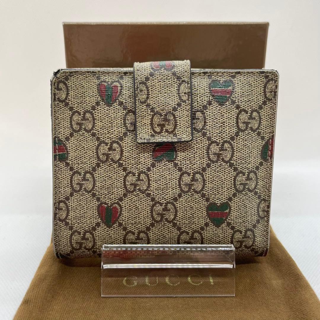 【美品/付属品完備】グッチ 二つ折り財布 小銭 GGシマ リボン ロゴチャーム