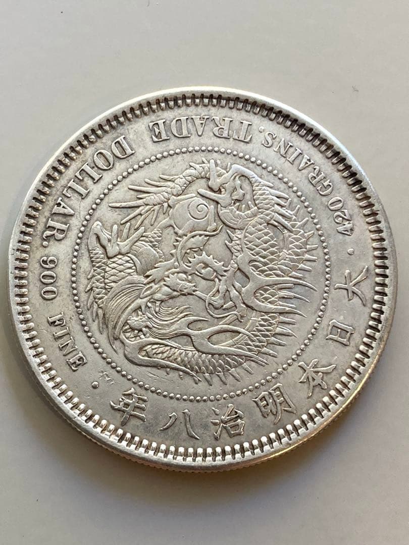 貿易銀　明治8年　菊紋・龍　　　約38.79㎜　約27.13g