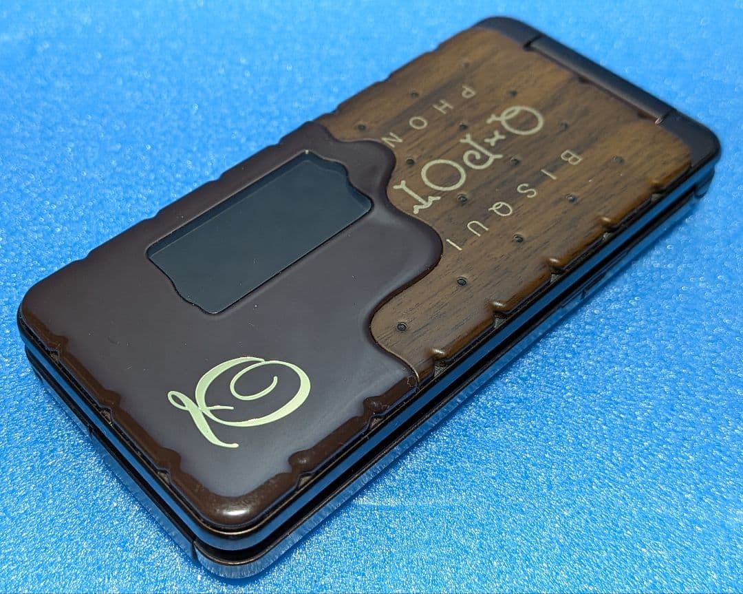 Q-pot. Phone SH-04C docomo チョコレートビスケット