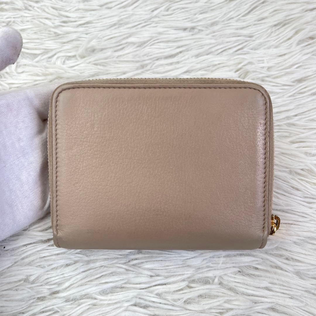 美品/現行✨イヴサンローラン 二つ折り財布　カサンドラ　YSL　ピンクベージュ