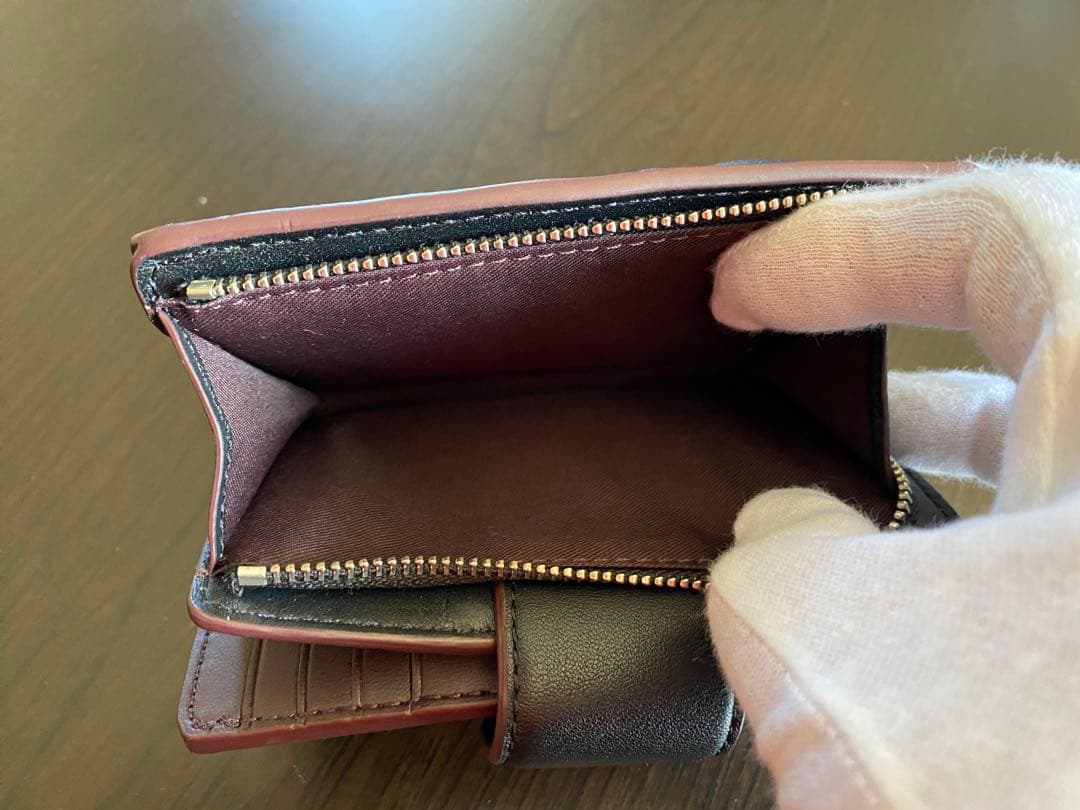 COACH エンボス加工 ブラック 二つ折り財布