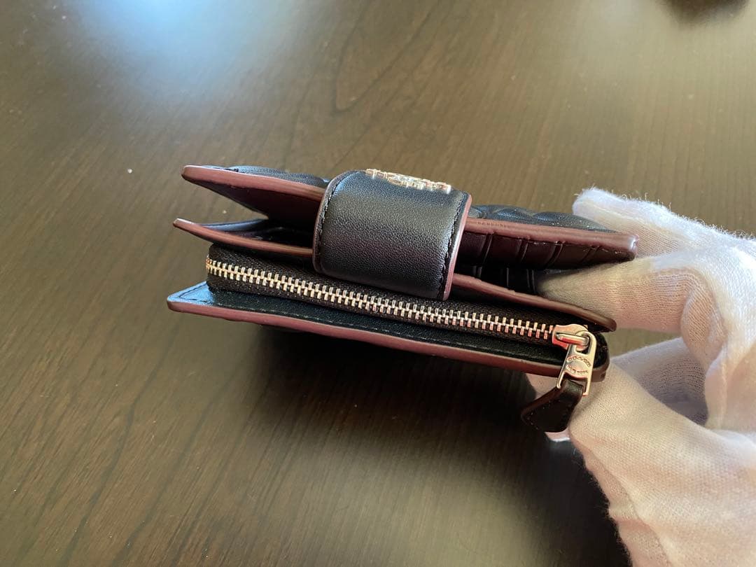 COACH エンボス加工 ブラック 二つ折り財布