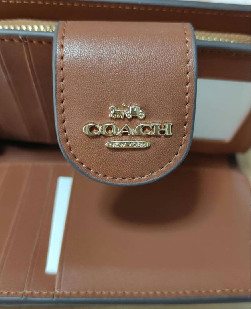 新品未使用 COACH 二つ折り財布 アウトレット品 シグネチャー 定番