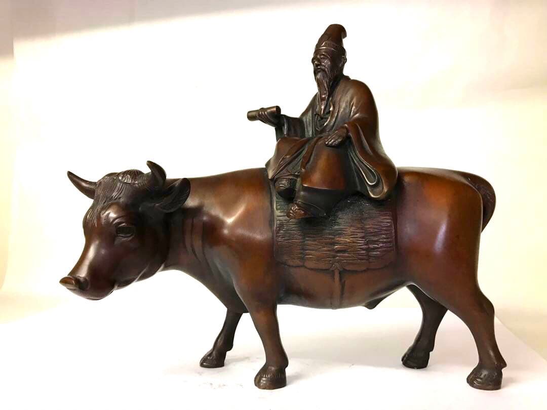 銅製:孔子牛乗図置物